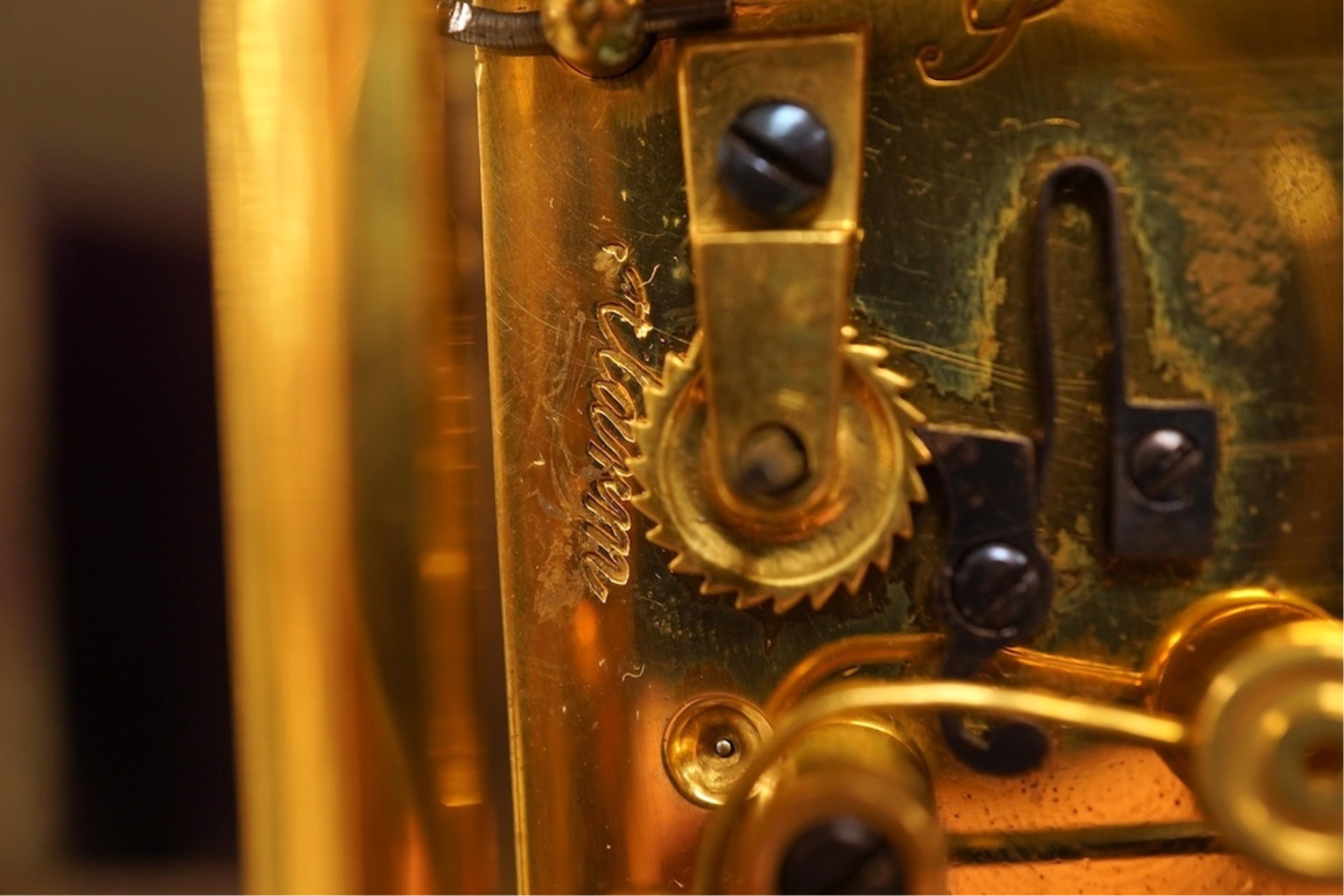 A French carriage clock with alarm, gong-striking movement, in a contemporary leather case, 17cm high